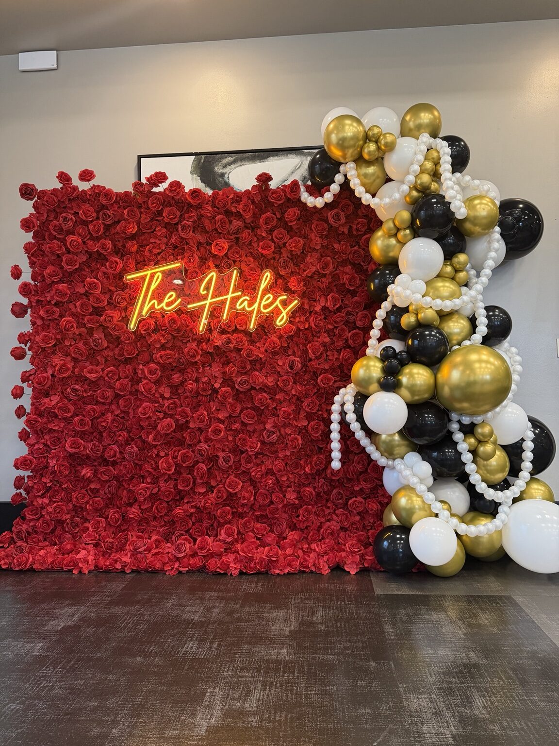 Luxury red rose wall with black, white and gold balloons